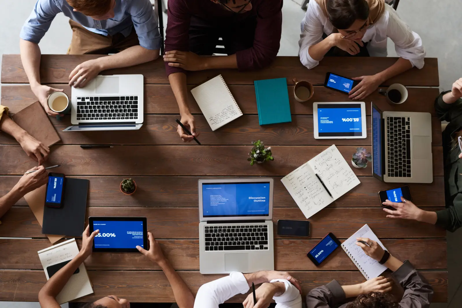 Modern development workspace with multiple screens showing code